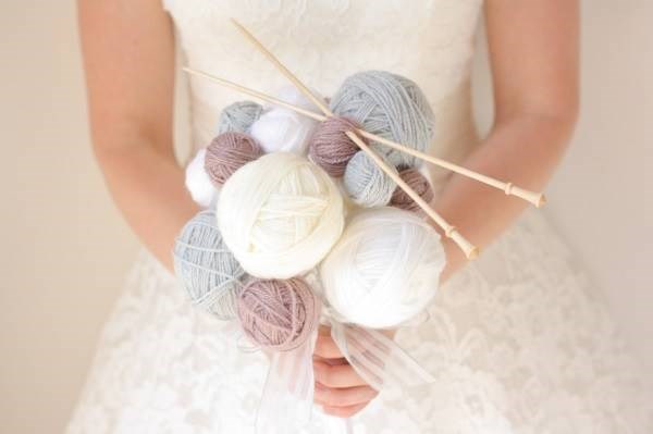 Balls of wool and knitting needles bridal bouquet