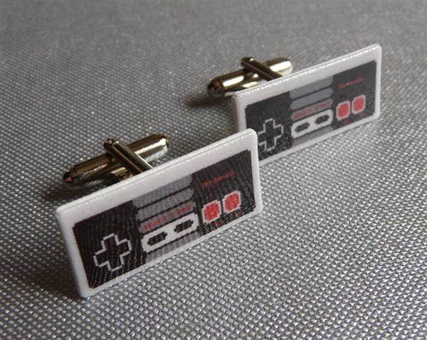 Classic NES control pad cufflinks by Pixel Party.