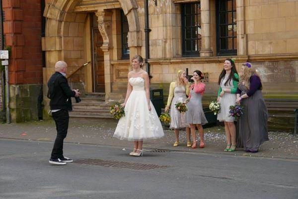 Rob Farrell at work about to photograph the bride