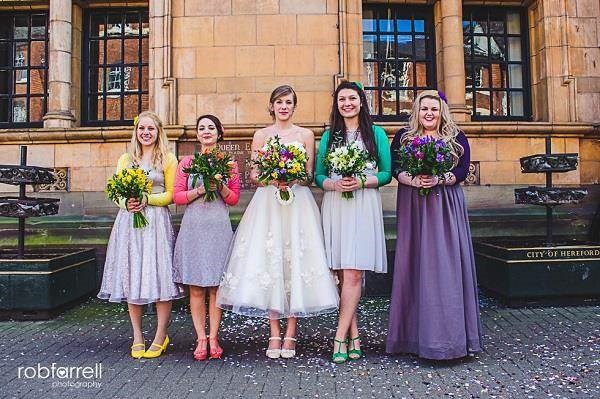 Bride and bridesmaids holding flowers