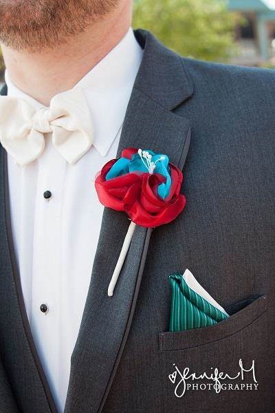 Red & blue buttonhole for a carnival wedding