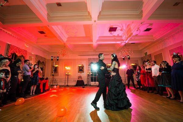 ride and groom enjoying their first dance at their Halloween wedding