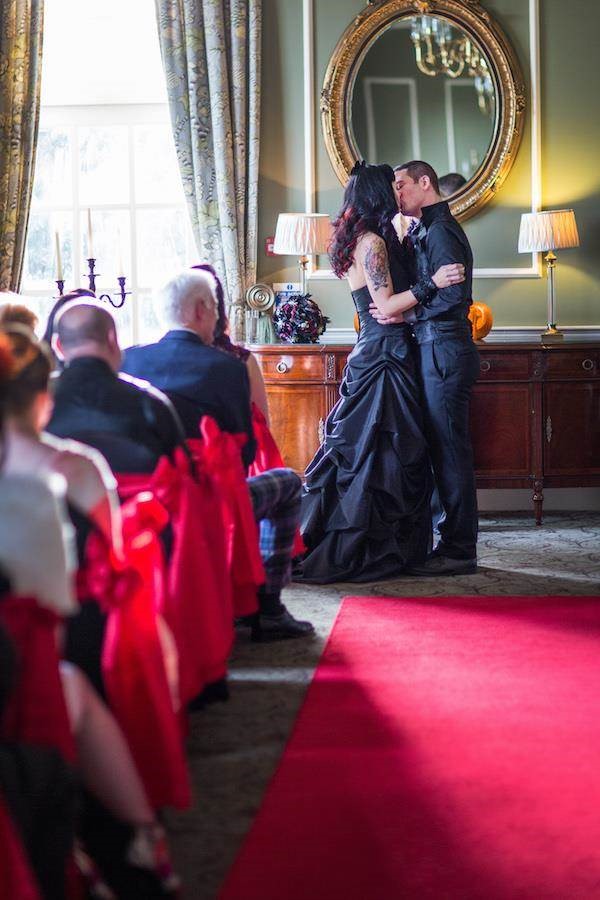 Halloween bride and groom kiss