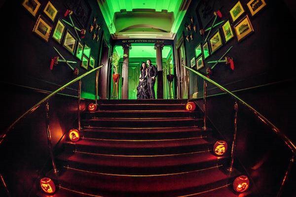 Atmospheric shot of the bride and groom at a Halloween wedding