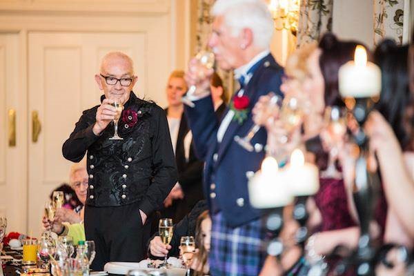 oasting the couple at a Halloween wedding