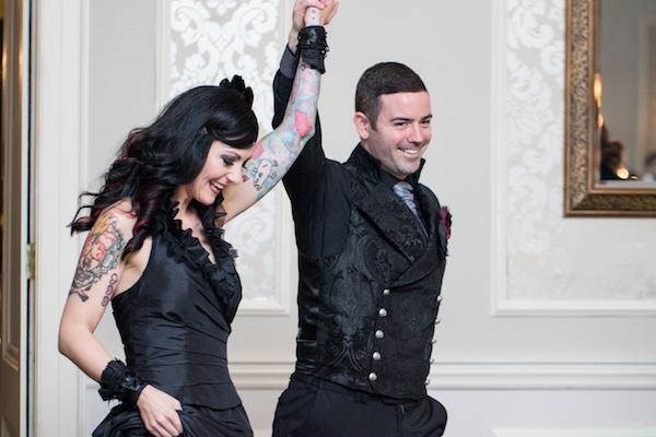 Tattooed bride and Gothic groom celebrating their marriage