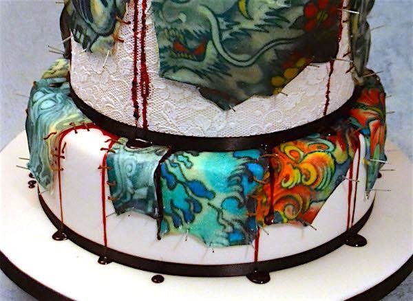 Tattooed skin wedding cake dripping with blood.