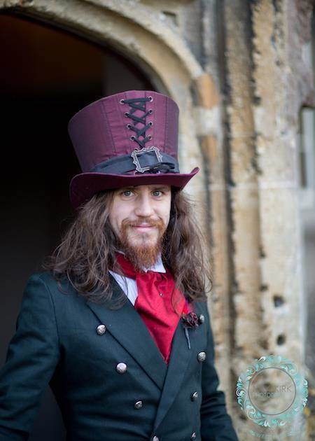 Gothic groom, sporting a superb hat.