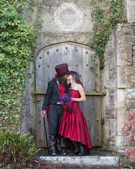 Gothic bride and groom kissing at Thornbury Castle.