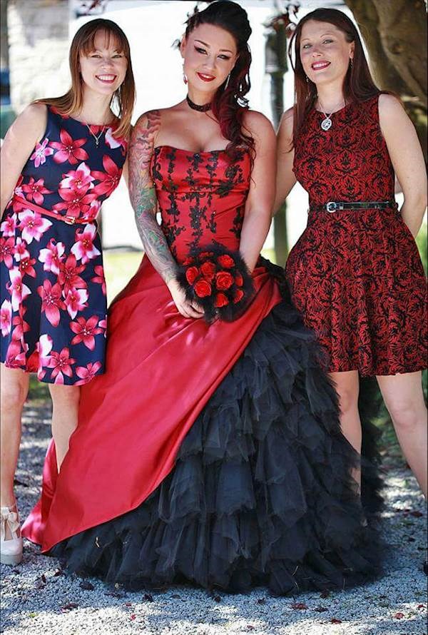 Tattooed bride in her red and black dress