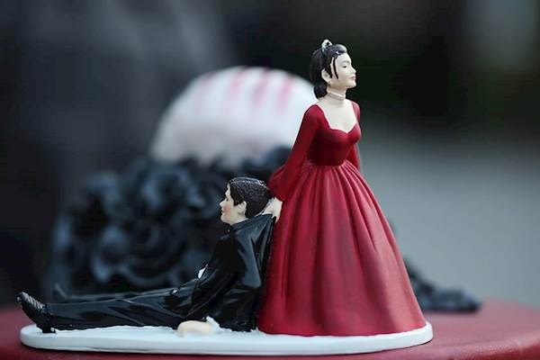 Bride dragging groom cake topper
