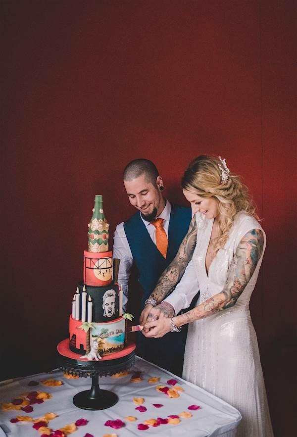 Bride and groom cutting their Lost Boys wedding cake.