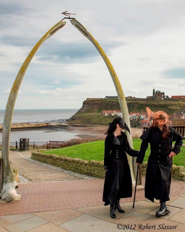 Karen & Rich sporting the raven and ram masks at the whalebone arch in Whitby. 