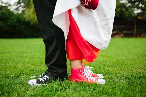 Bride and groom rocking Converse, photo by Lorna Lovecraft | Misfit Wedding