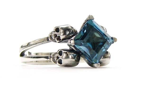 Double skull engagement ring with Blue Topaz gemstone from KIPKALINKA | Misfit Wedding
